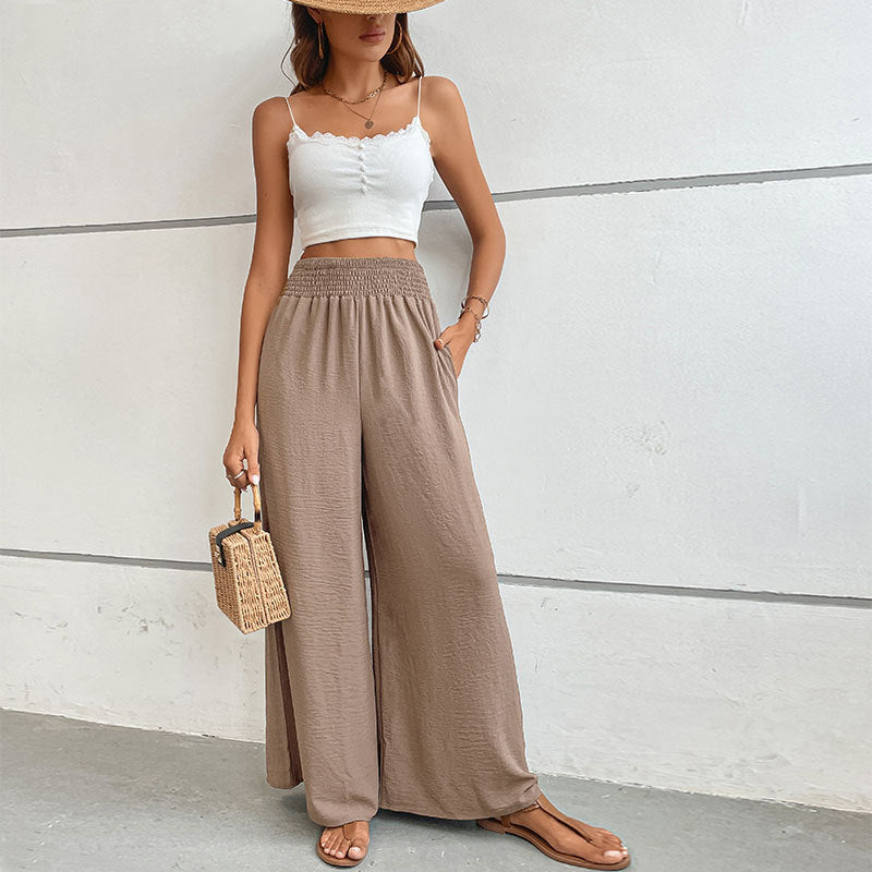 Women's palazzo pants with a high, elastic ruffled waistband and side pockets Mune Fashion