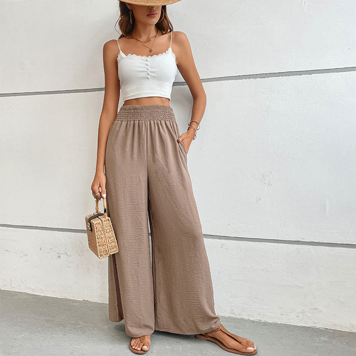 Women's palazzo pants with a high, elastic ruffled waistband and side pockets Mune Fashion