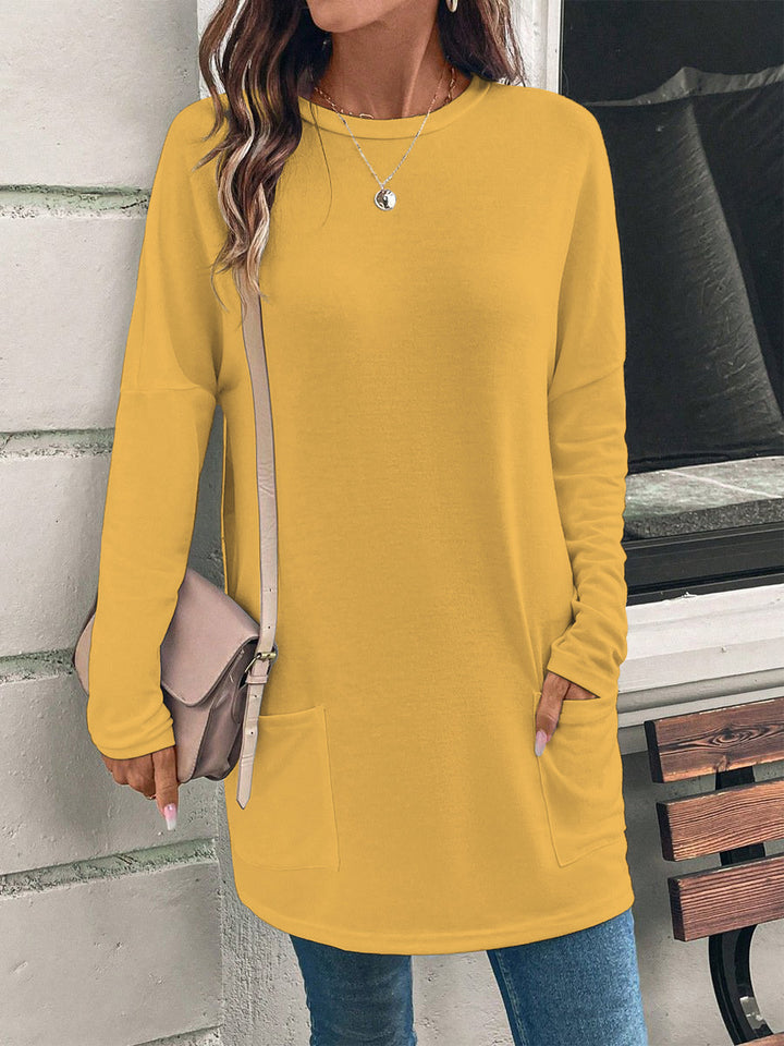 Women's loosely cut long tunic with round neckline, side pockets, and soft jersey Mune Fashion