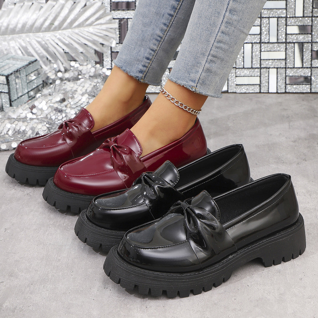 Women’s shiny platform loafers with oversized bow appliqué and profiled rubber sole Mune Fashion