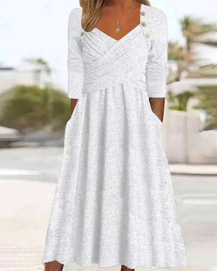 Women's knitted maxi dress with wrap top V-neck, side pockets and decorative button placket Mune Fashion
