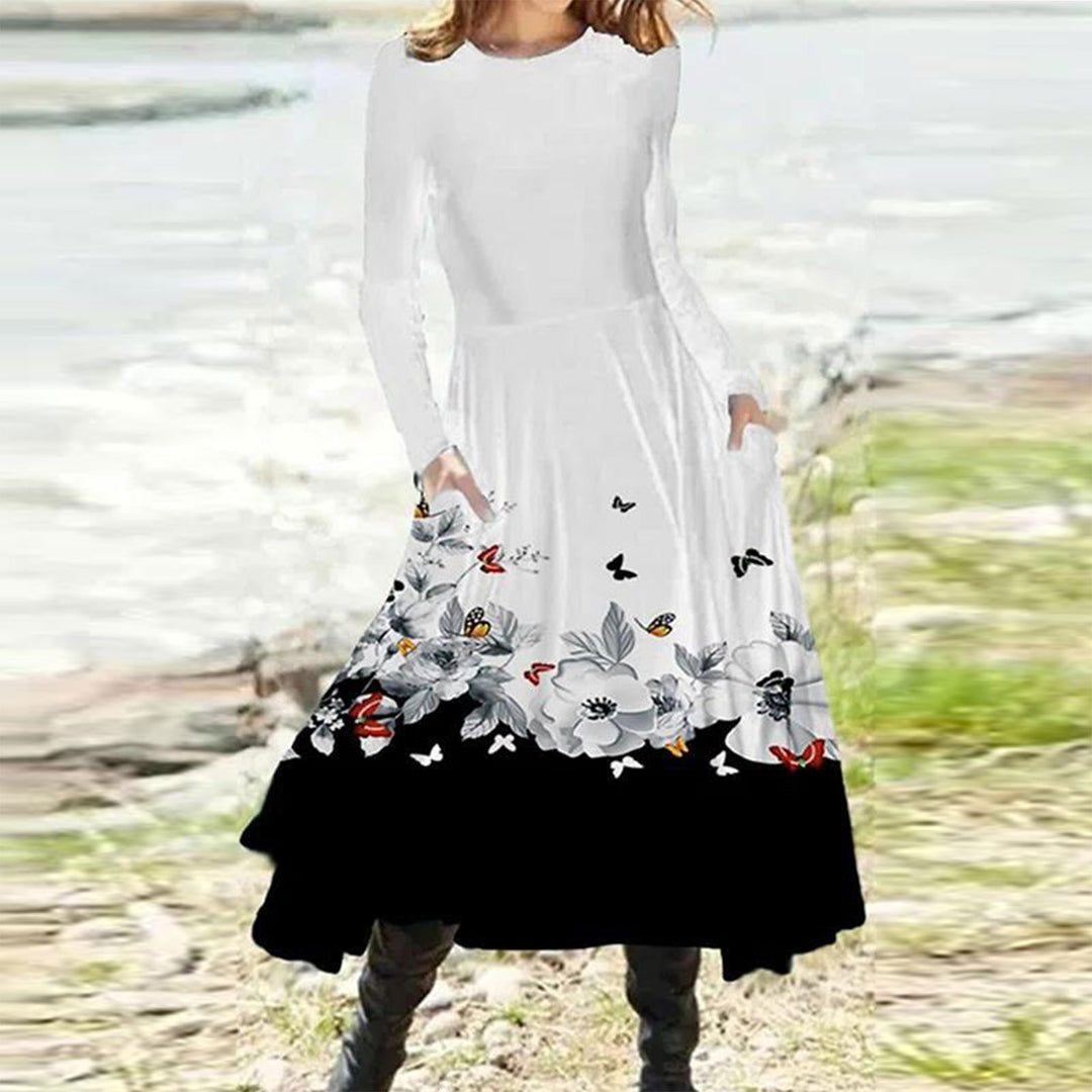 Women's flowing maxi dress with tie-dye circle pattern, round neckline, waist seam, and side pockets Mune Fashion