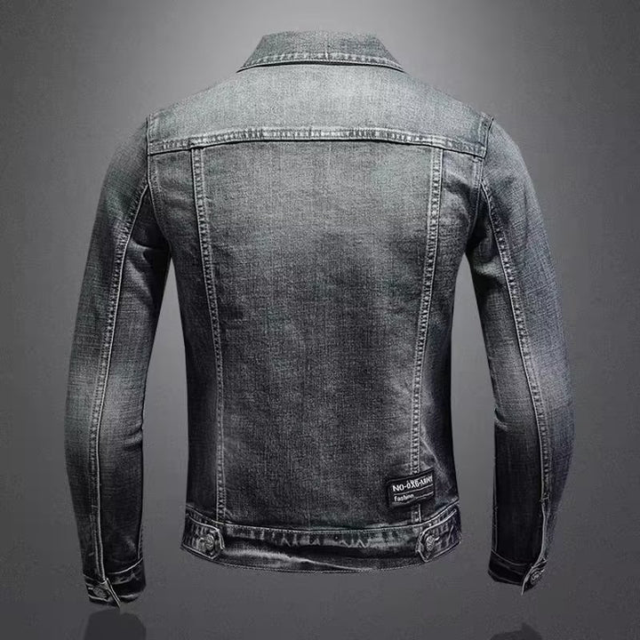 Men's jeans jacket with used wash, press stud chest pockets and discreet Mune Fashion embroidery.