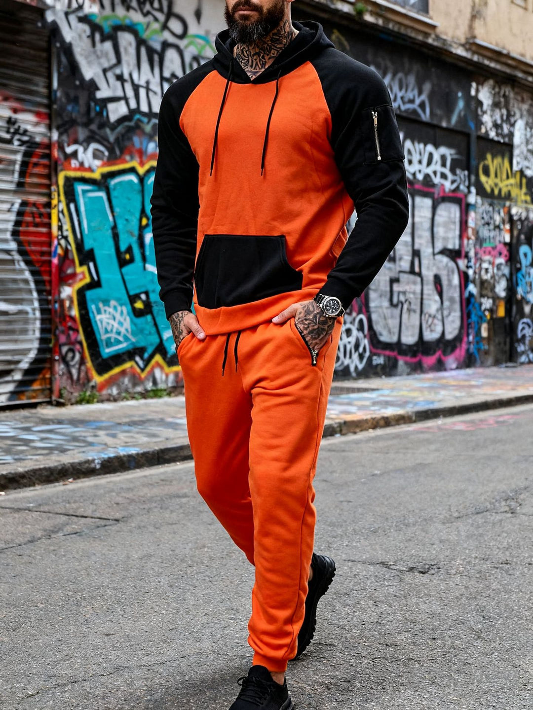 Men's two-piece hooded sweat set with raglan sleeves, sleeve zip pocket, and tapered jogging pants Mune Fashion