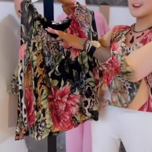 Women's light satin blouse with animal and floral print, ruffled collar, V-neck and cuffed sleeves Mune Fashion
