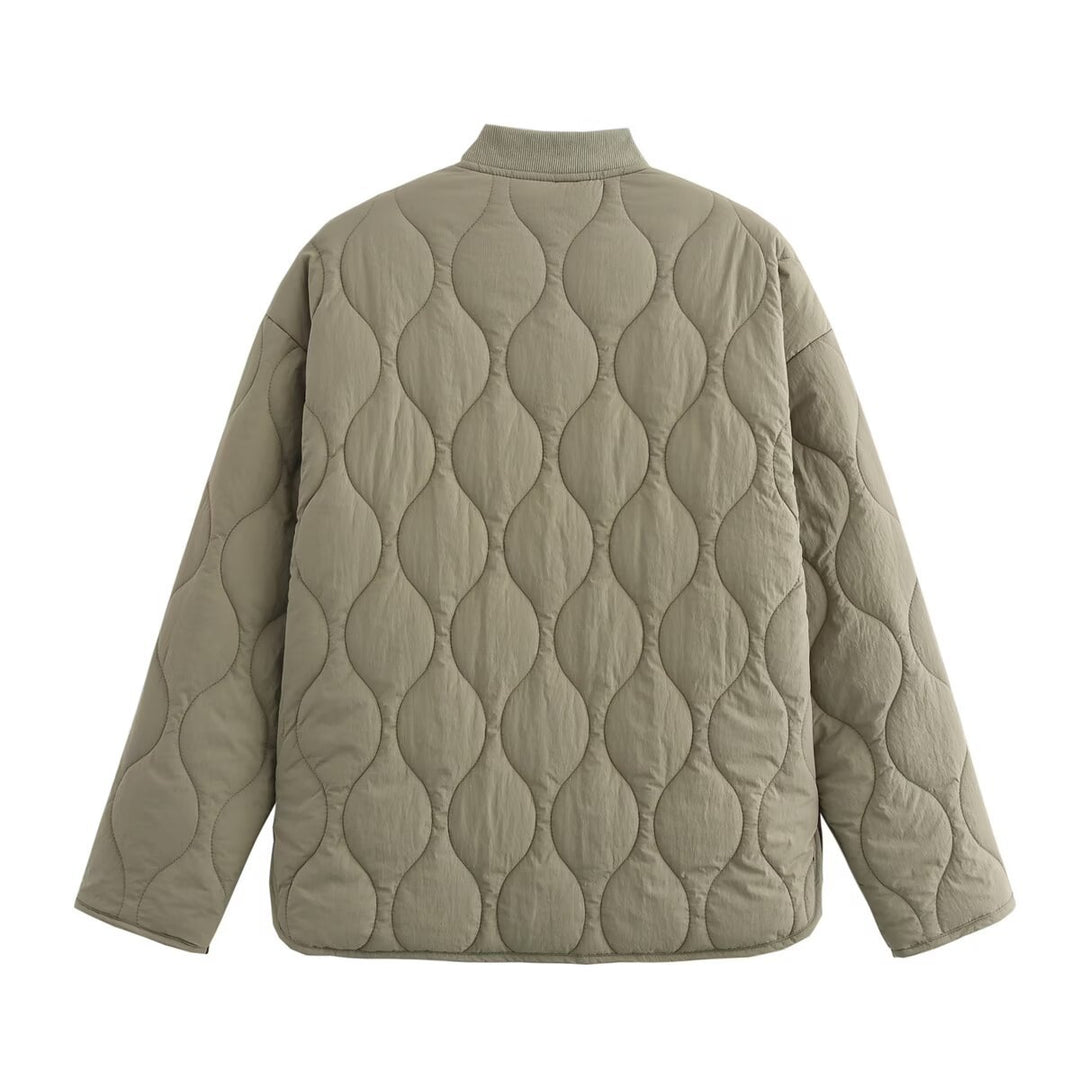 Women's quilted jacket with round neck, flap pockets, and reversible lining Mune Fashion