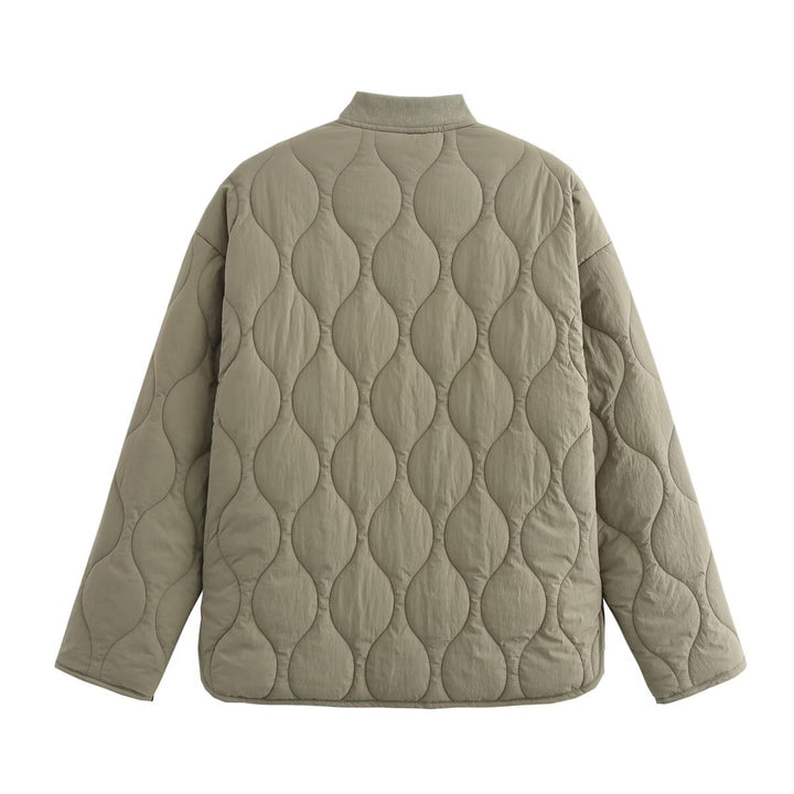 Women's quilted jacket with round neck, flap pockets, and reversible lining Mune Fashion