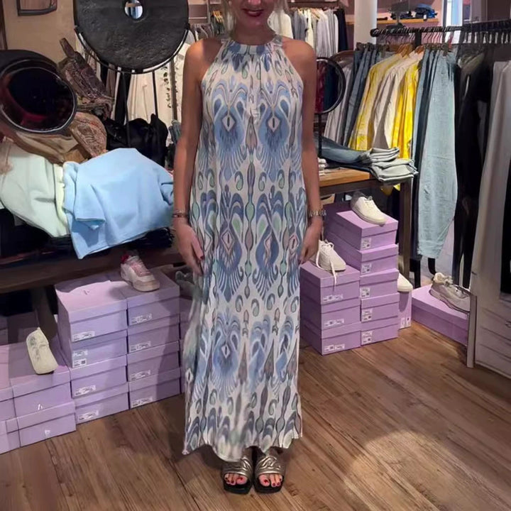 Women's flowing maxi dress with halter neck, ornamental ikat print and wide fall Mune Fashion