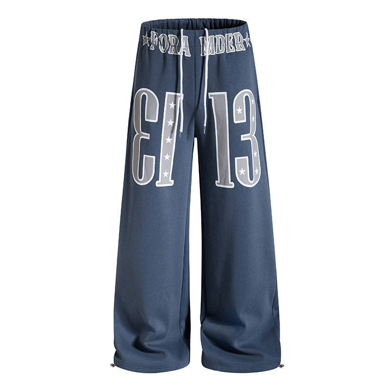 Women's Wide Palazzo Jogging Pants with High Comfort Waistband, Drawstring and Large Graphic Front Mune Fashion
