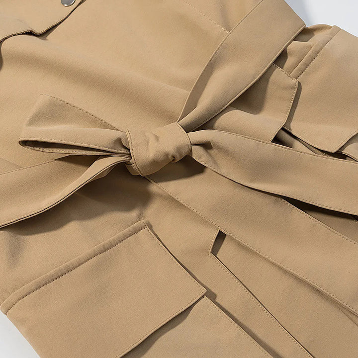 Women's tailored trench parka with tie belt, asymmetrical flap and large patch pockets Mune Fashion