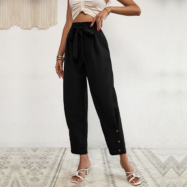 Ladies high-waisted paperbag trousers with tie belt, tapered leg and decorative button placket Mune Fashion