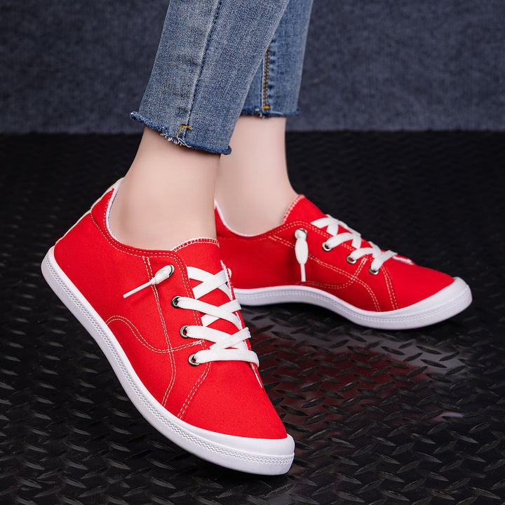 Women’s classic canvas low-top sneakers with reinforced rubber sole, metal eyelets, and padded heel collar Mune Fashion