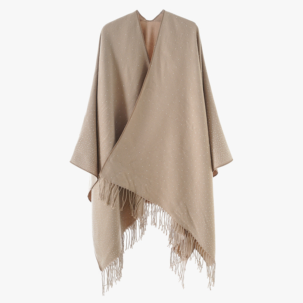 Women’s knitted poncho with fringes and subtle shimmer embellishment Mune Fashion