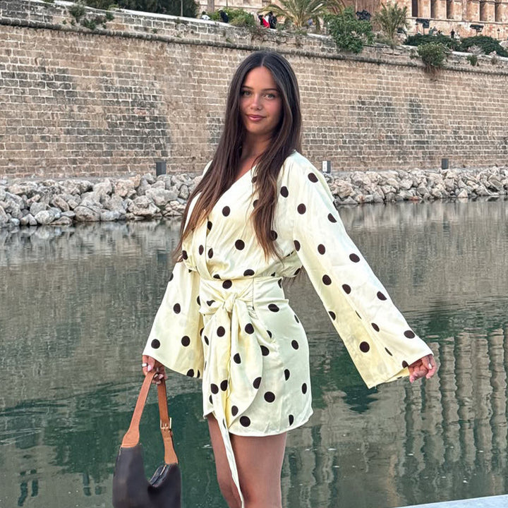 Ladies wrap mini dress with V-neck, bell sleeves and polka dot print Mune Fashion