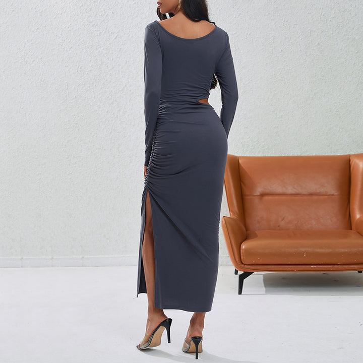 Women's a fitted maxi dress with long sleeves, side cut-out, gathered hip, and high leg slit.