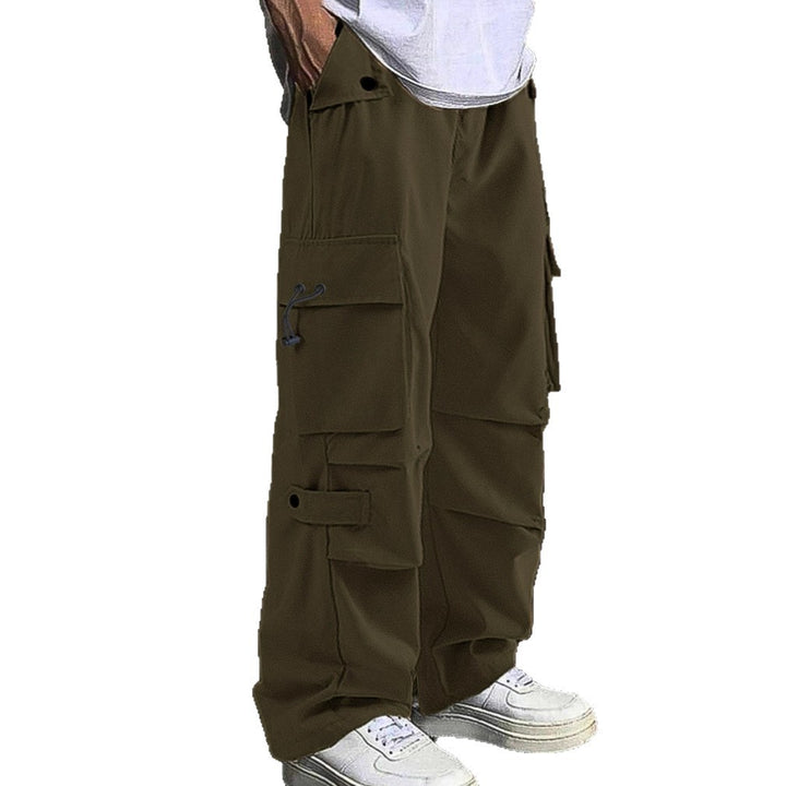 Men's baggy cargo pants with utilitarian flap pockets, drawstring waistband, and reinforced seams Mune Fashion