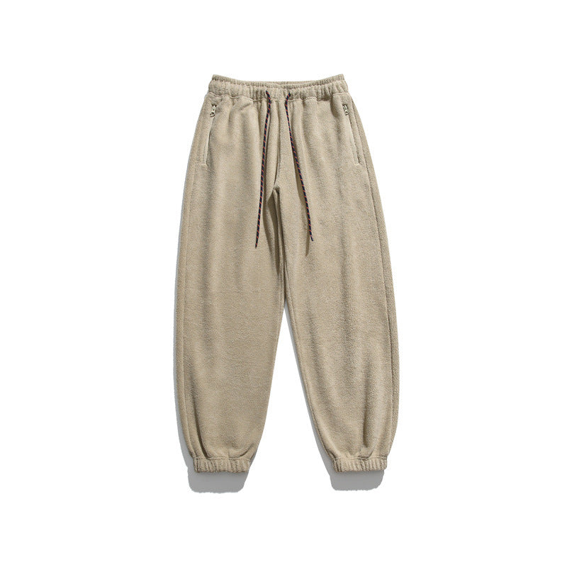 Men's wide-cut fleece jogging pants with elastic cuffs and side pockets Mune Fashion