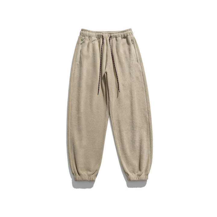 Men's wide-cut fleece jogging pants with elastic cuffs and side pockets Mune Fashion
