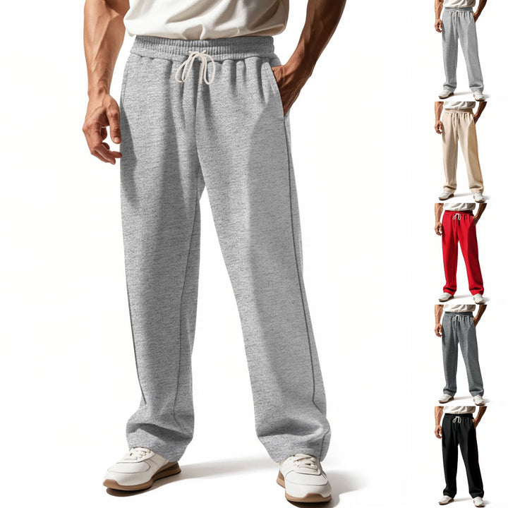 Men's casually fitting sweatpants with side decorative seam, elastic comfort waistband, and deep side pockets Mune Fashion