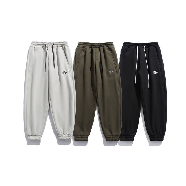 Unisex locker cut fleece jogging pants with drawstring, elastic hem and side pockets Mune Fashion