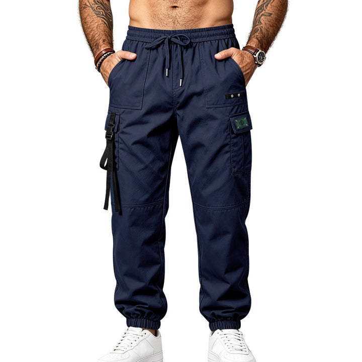 Men's utility cargo pants in jogger style with elastic waistband, multiple pockets and leg straps Mune Fashion