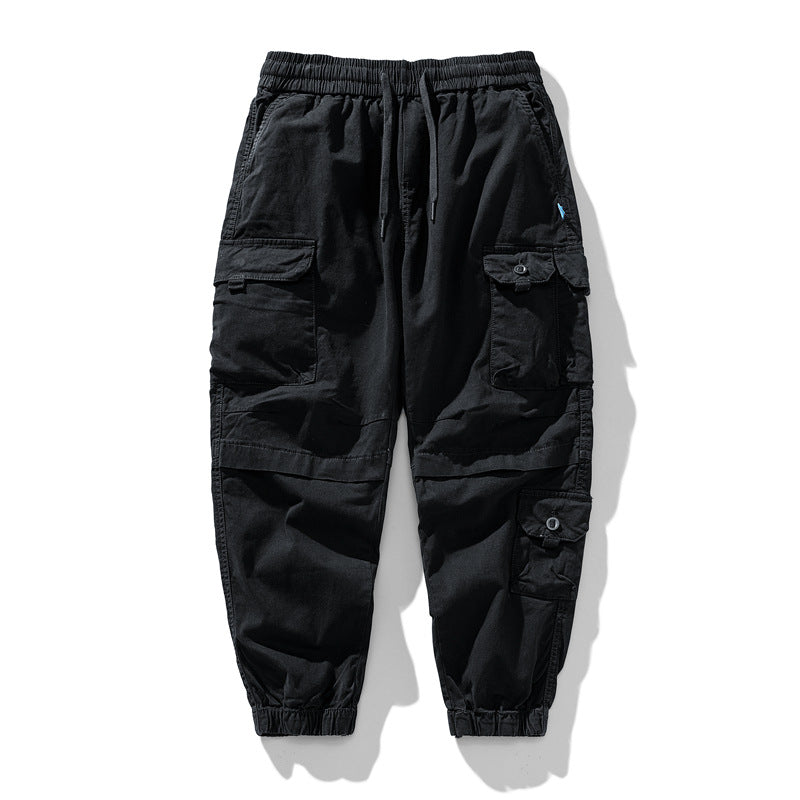 Herren Leichte Canvas-Cargohose im Joggerstil mit elastischem Bund, segmentierten Kniepaneelen und verdeckten Klappentaschen Mune Fashion