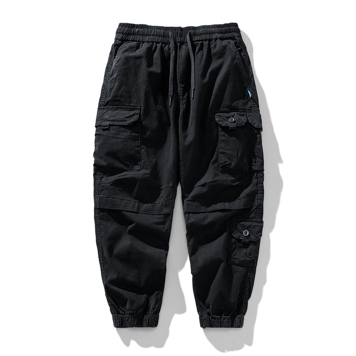 Herren Leichte Canvas-Cargohose im Joggerstil mit elastischem Bund, segmentierten Kniepaneelen und verdeckten Klappentaschen Mune Fashion