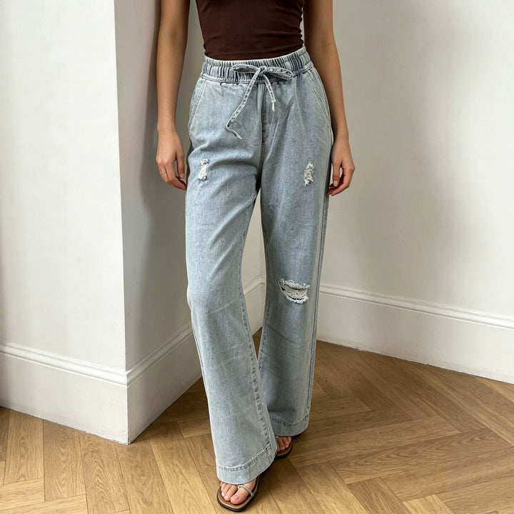 Women's wide denim pants with elastic drawstring waistband, used effects and relaxed fit Mune Fashion