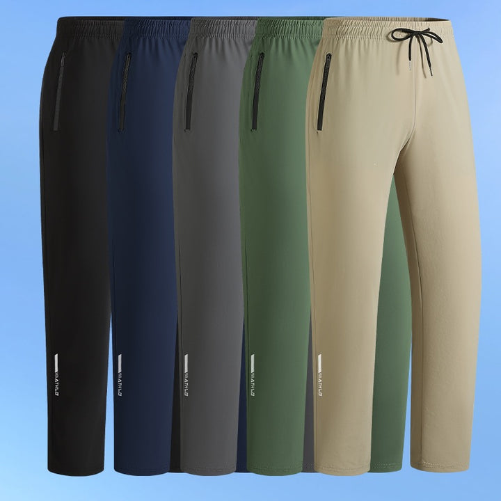 Men's sporty jogging pants with elastic waistband and practical zip pockets Mune Fashion