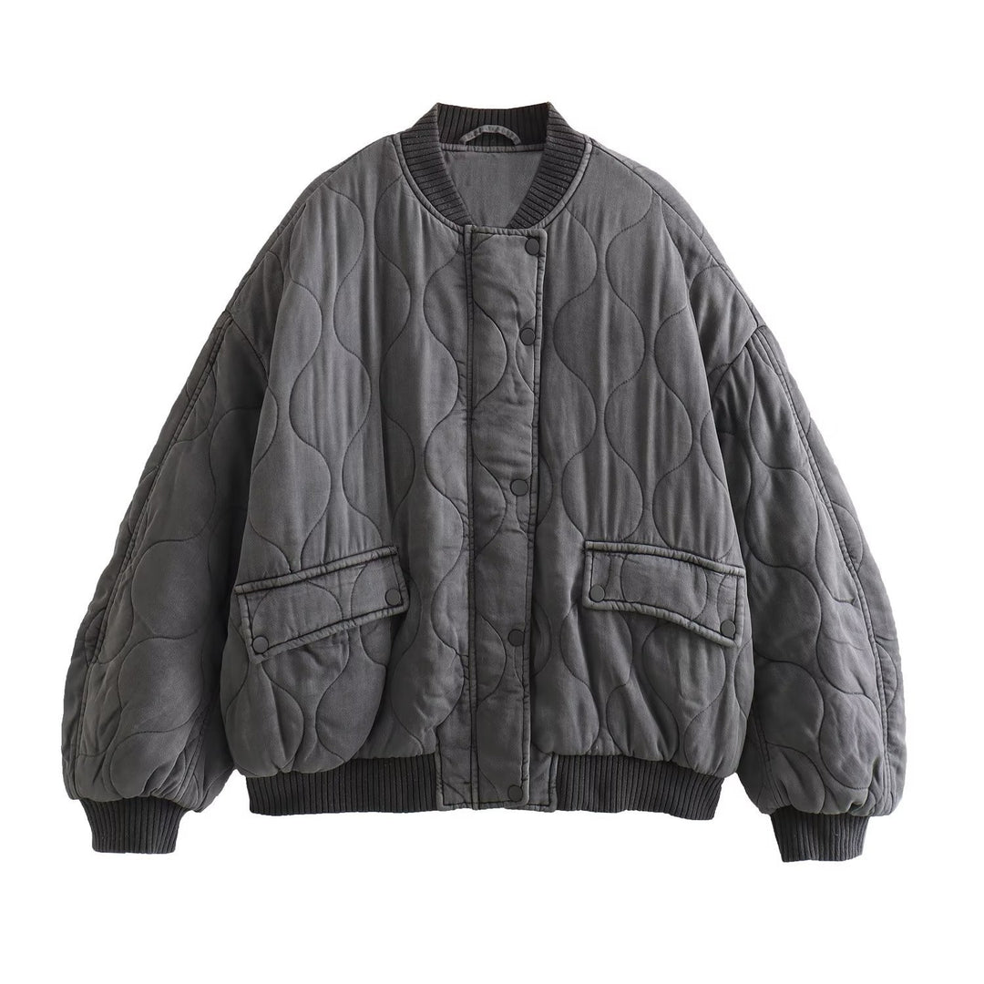 Women's quilted bomber jacket with oversized silhouette, ribbed cuffs, and flap pockets Mune Fashion