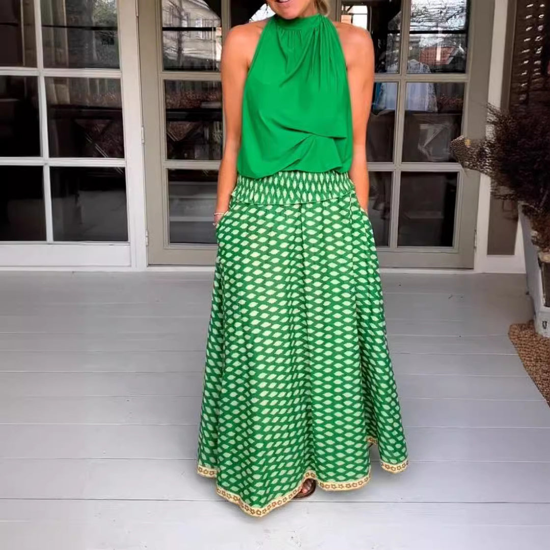 Women's two-piece halter neck set with gathered stand collar and patterned maxi skirt with elastic smocked waistband Mune Fashion