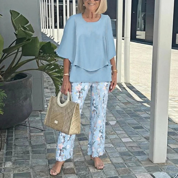 Women's layered tunic with cape sleeves and ankle-length straight leg pants with graphic print Mune Fashion