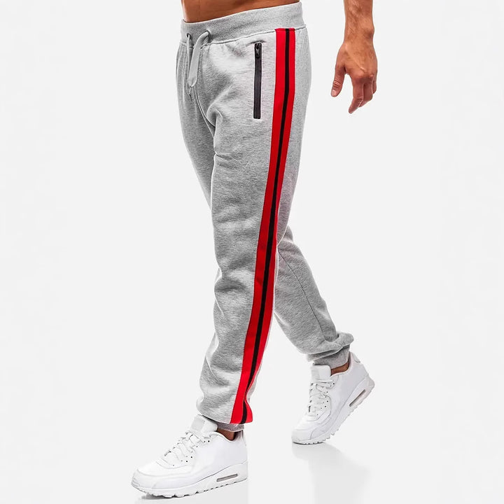 Men's narrow tapered fleece jogging pants with two-tone side piping and water-repellent zip pockets Mune Fashion