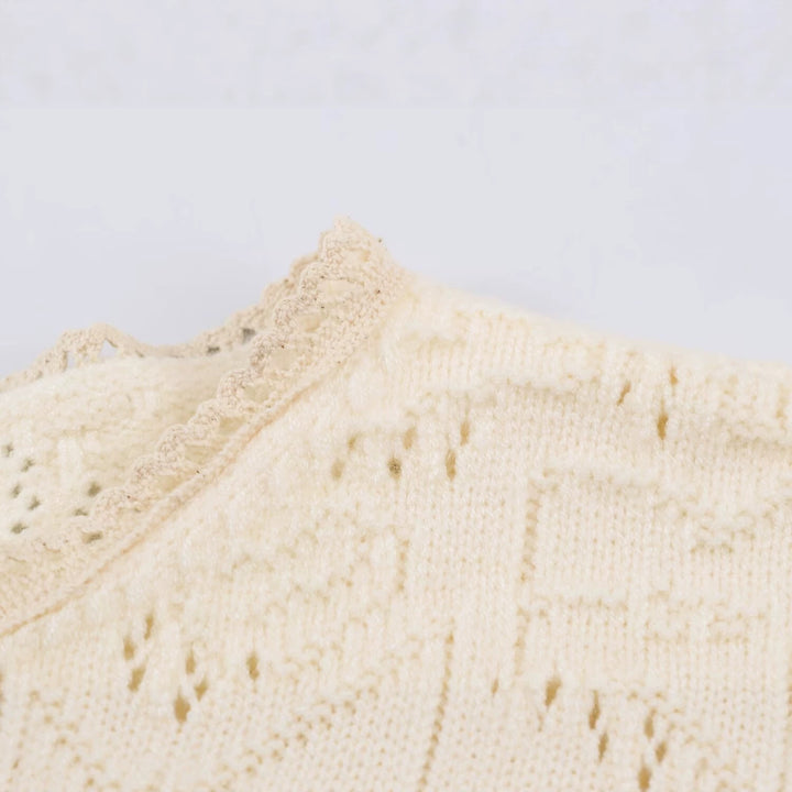 Women's fine knit cardigan in blouse style with embroidered puff sleeves and ruffle hem Mune Fashion