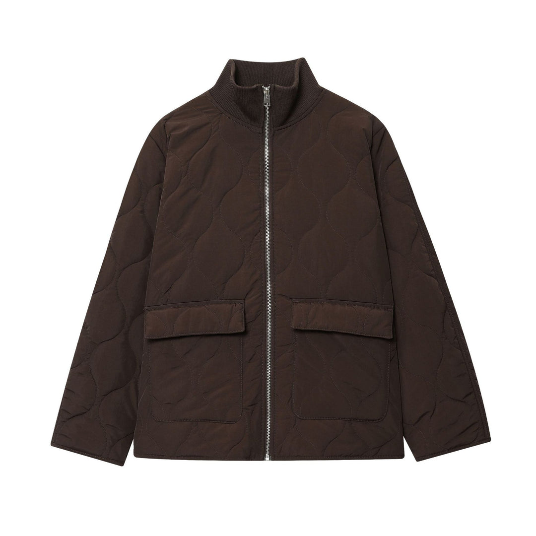 Women's lightweight quilted jacket with round quilting, high ribbed collar, and patch flap pockets Mune Fashion