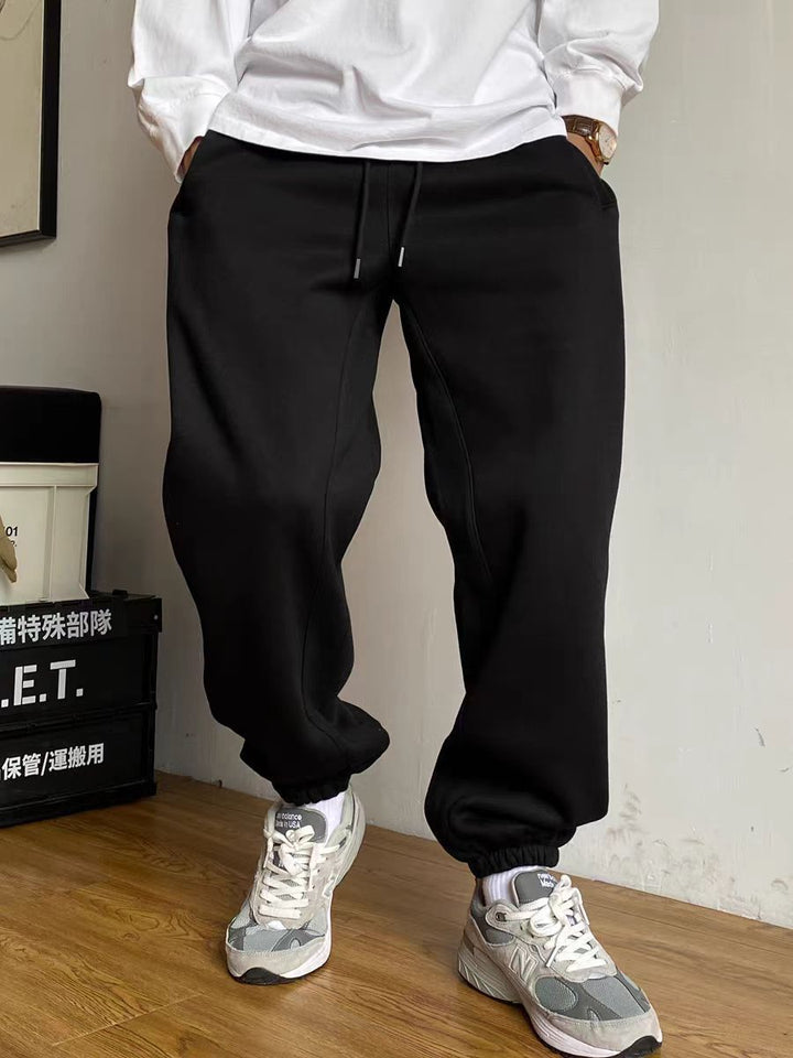 Men's nan tapered jogging pants with distinctive seam, drawstring, and elastic ankle cuffs Mune Fashion