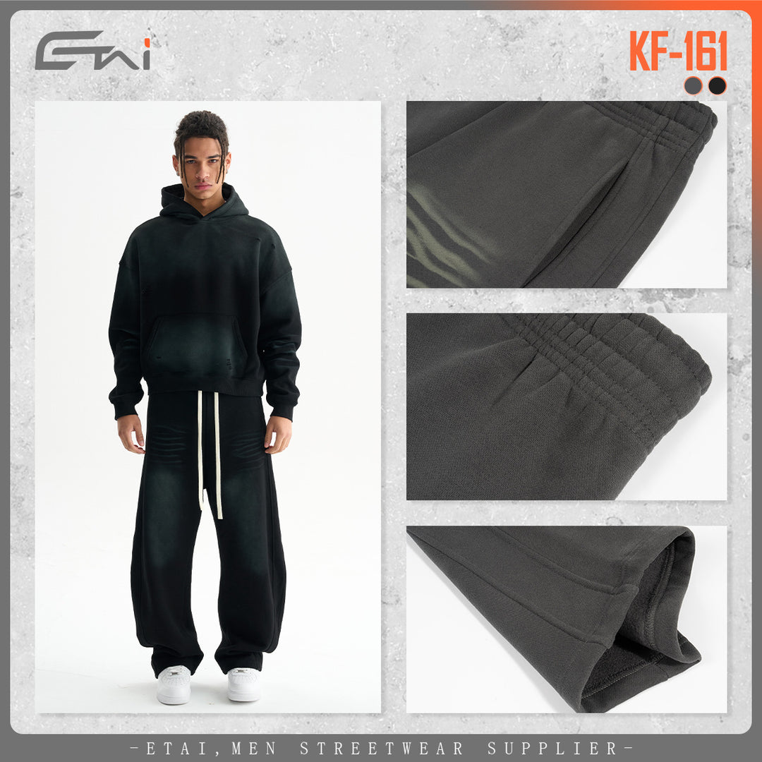 Men's baggy sweatpants with low crotch, contrasting decorative seams, and extra long drawstrings.