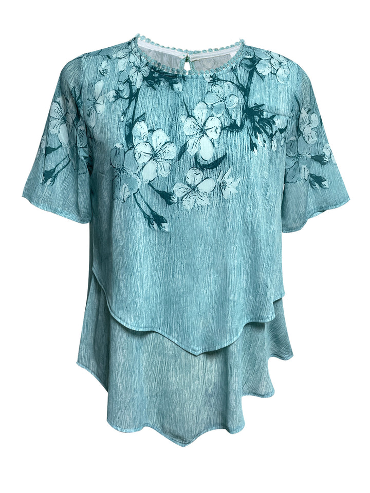 Women's two-layer blouse dress with asymmetrical tiered hem, floral print yoke, and wing sleeves Mune Fashion