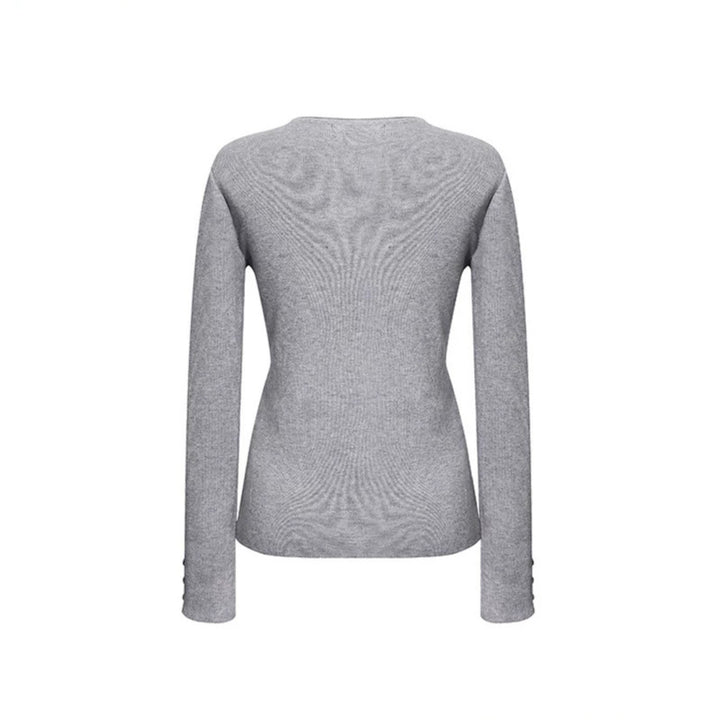 Women's fine knit sweater with round neckline, slim silhouette, and decorative button sleeves Mune Fashion