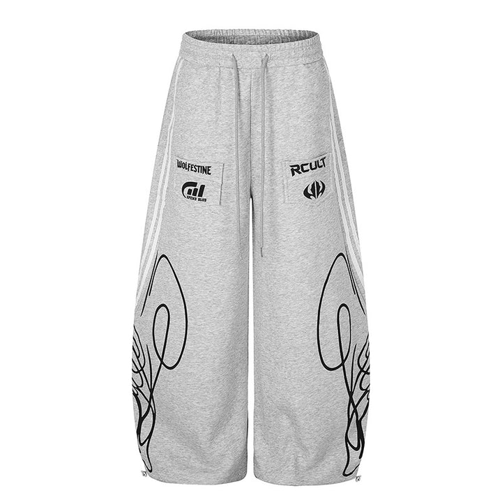 Women's Wide Midi Lounge Sweatpants in Palazzo Cut with Drawstring, Zip Hem and Statement Print Mune Fashion