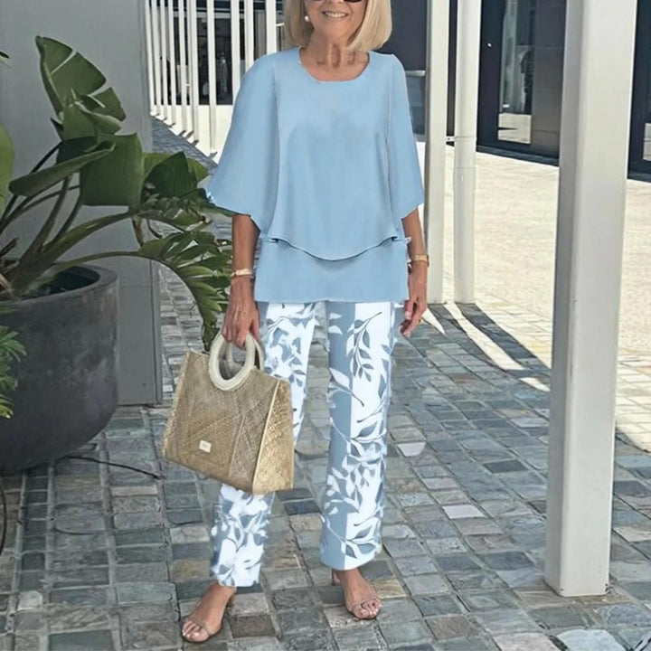 Women's layered tunic with cape sleeves and ankle-length straight leg pants with graphic print Mune Fashion