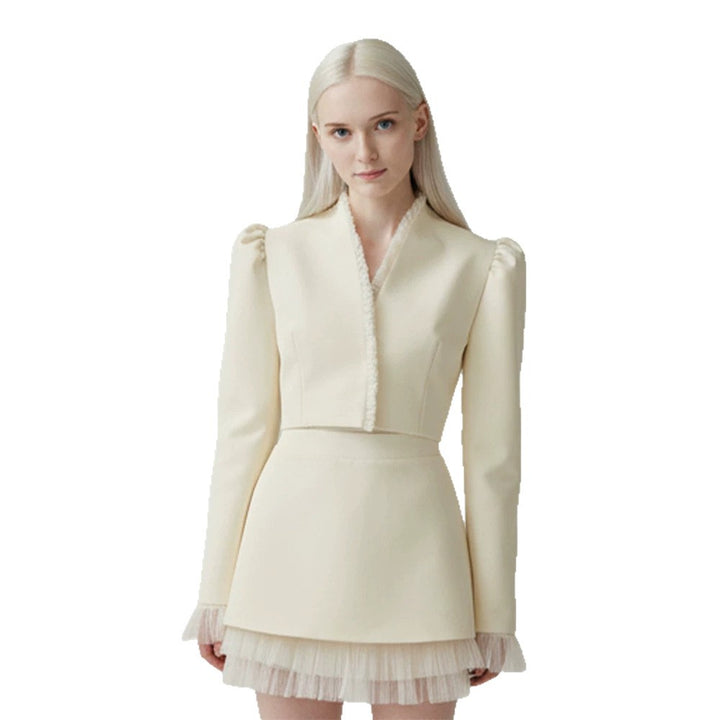 Ladies short blazer with tailored cropped silhouette, gathered shoulders and delicate tulle cuffs Mune Fashion