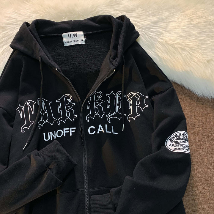 Unisex zip-up hoodie with Gothic lettering, hood, kangaroo pocket, and sleeve flock patch Mune Fashion