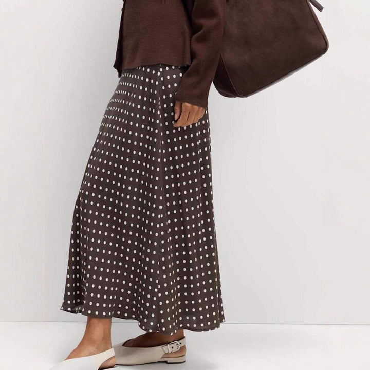 Women's midi skirt with polka dot pattern, asymmetrical hem and side slit Mune Fashion
