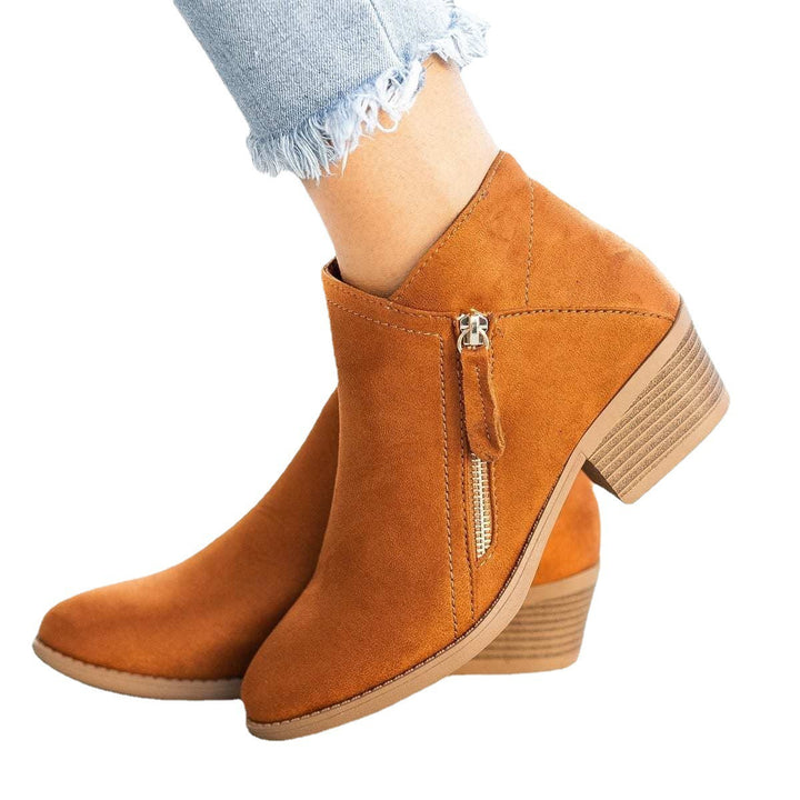 Ladies ankle-high suede-look ankle boots with a sleek round toe, side metal zipper, and stacked block heel Mune Fashion
