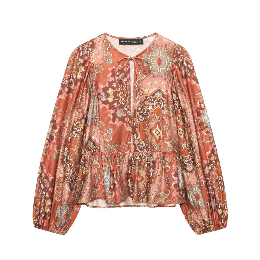 Women's Boho blouse with paisley print, tie neck, gathered waist, and voluminous balloon sleeves Mune Fashion