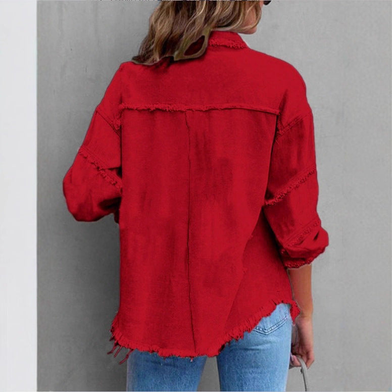 Women's oversized denim shirt jacket with fringe trim, flap pockets, and snap front Mune Fashion