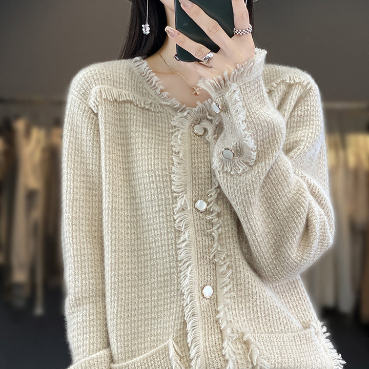Women's knitted cardigan with fringe trim, mother-of-pearl button placket, and patch pockets Mune Fashion