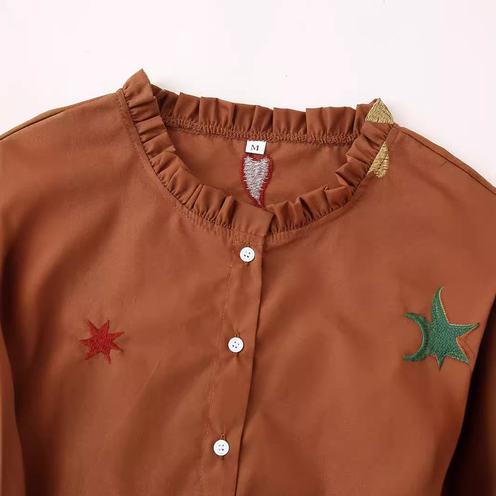 Ladies embroidered tunic blouse with ruffled collar, continuous button placket and balloon sleeves Mune Fashion