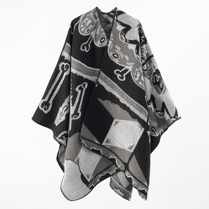 Women's statement cape poncho made from jacquard woven wool blend with skull and bone pattern Mune Fashion